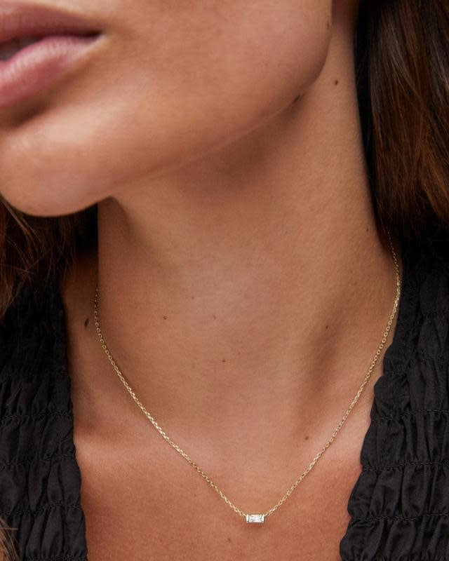 Juliette pendant necklace with white crystal baguette stone on a 14k yellow gold over brass chain.