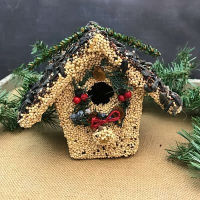 Hand-decorated wooden birdhouse with millet, sunflower seeds, juniper berries, cranberries, and raisins.