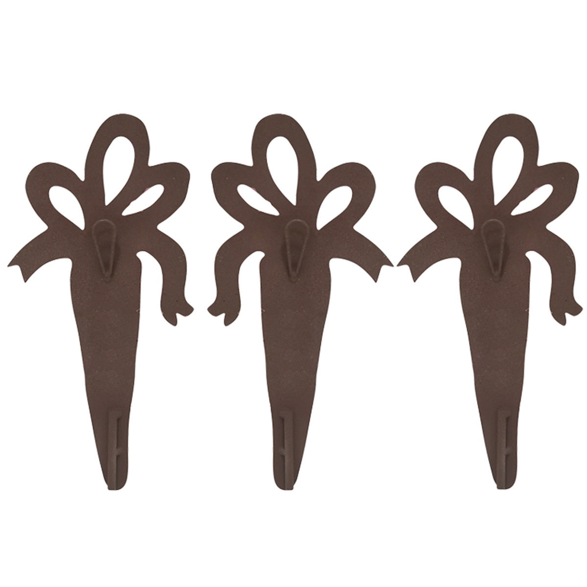 Three brown metal garden stakes shaped like bows with pointed bottoms.