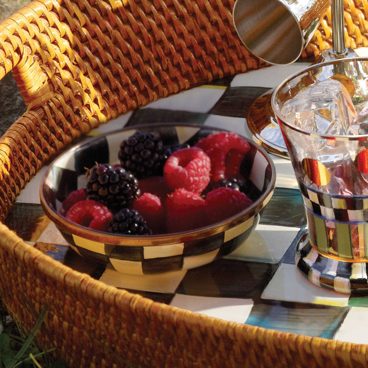 Hand-painted Courtly Check Relish Dish filled with fresh berries on a checkered tray.