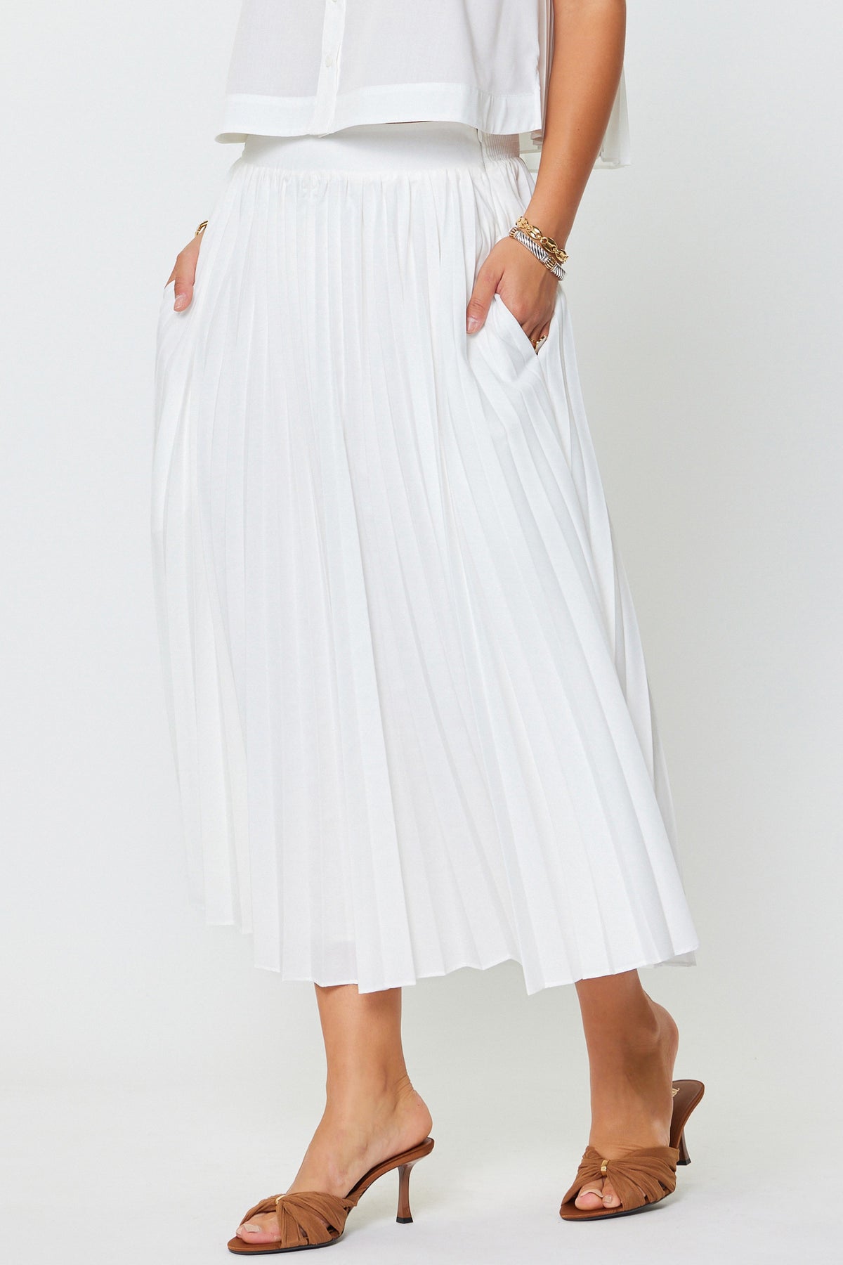 Ivy pleated A-line maxi skirt with smocked back waist in poly-cotton fabric.