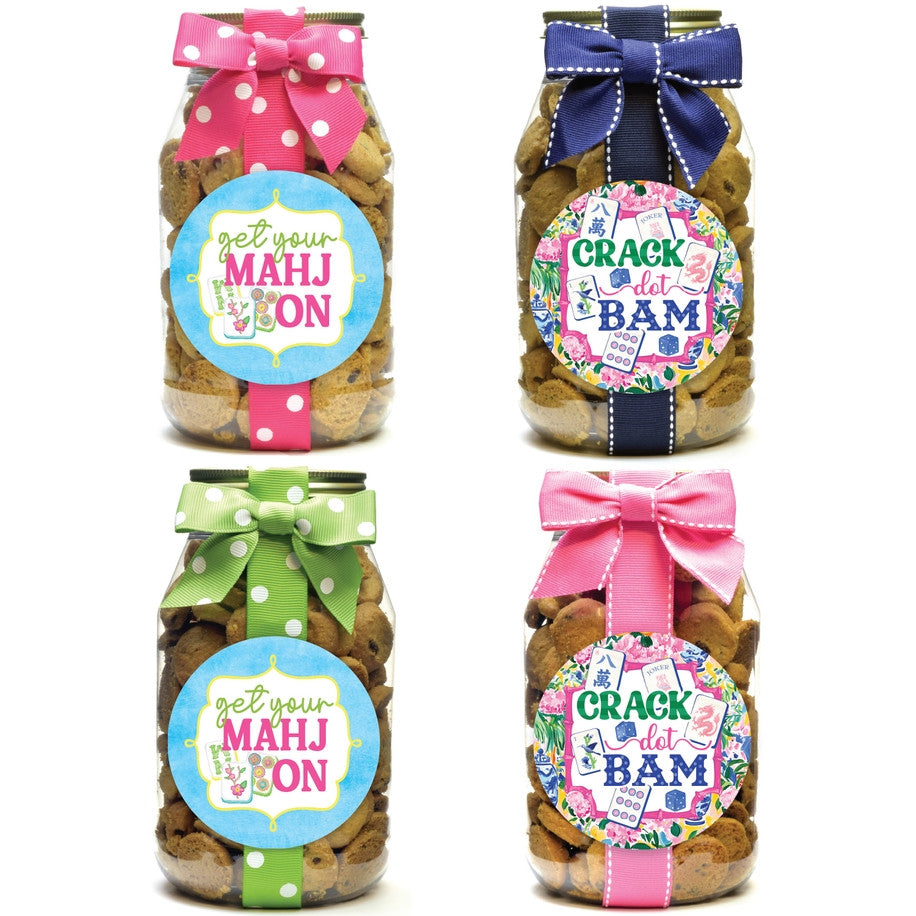 Four quart-sized cookie jars with Mahjong-themed labels and colorful polka dot or solid bows.