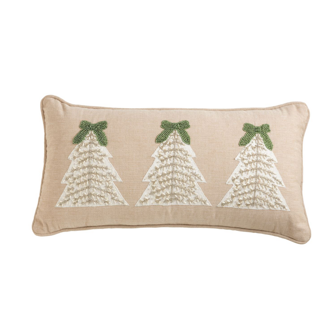 Lumbar beige pillow featuring three white beaded Christmas trees with green beaded bows.