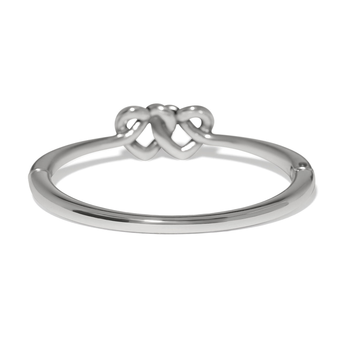 Silver plated hinged bangle featuring two interlocking hearts at the center.
