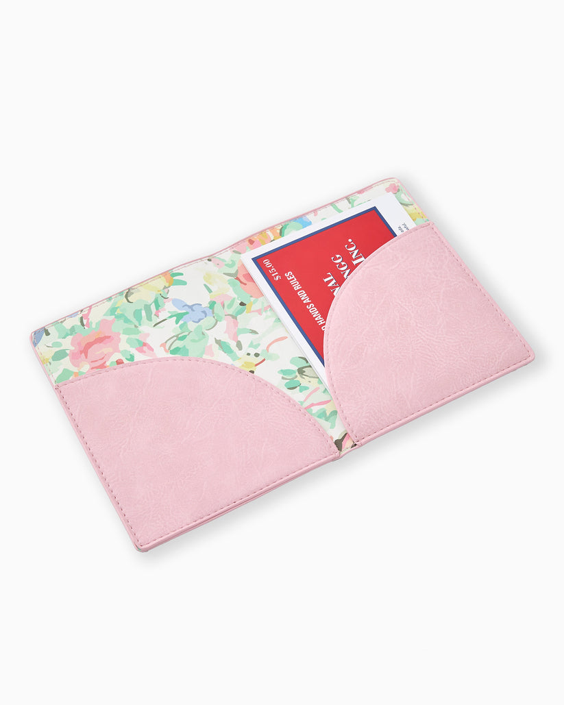 Open light pink mahjong card folio with floral interior lining and a red card inside.