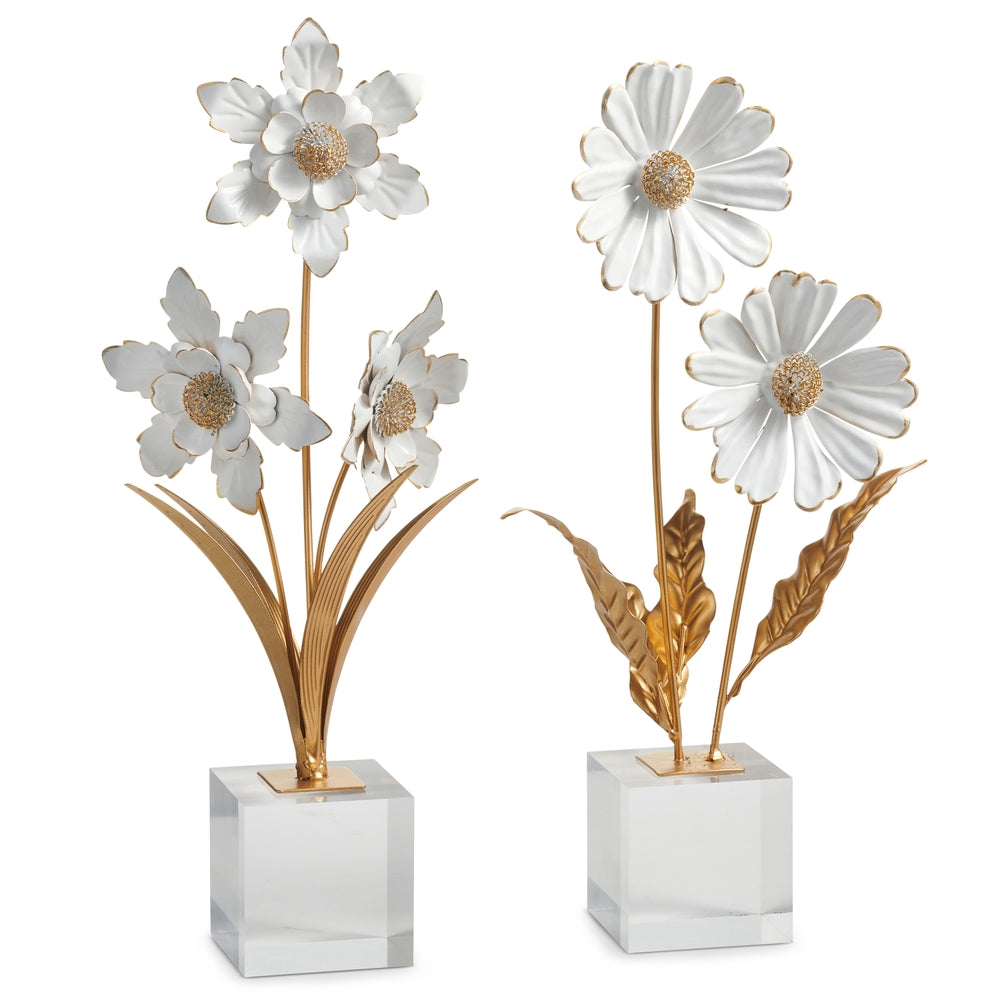 White floral arrangement on a clear acrylic block with iron accents.
