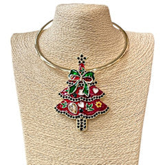 Gold collar necklace with a large red enamel Christmas tree pendant and green bow detail.