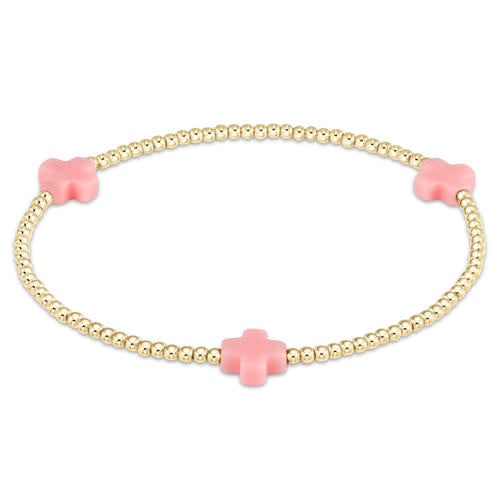 Small gold-patterned bracelet with 2mm beads on elastic cord.