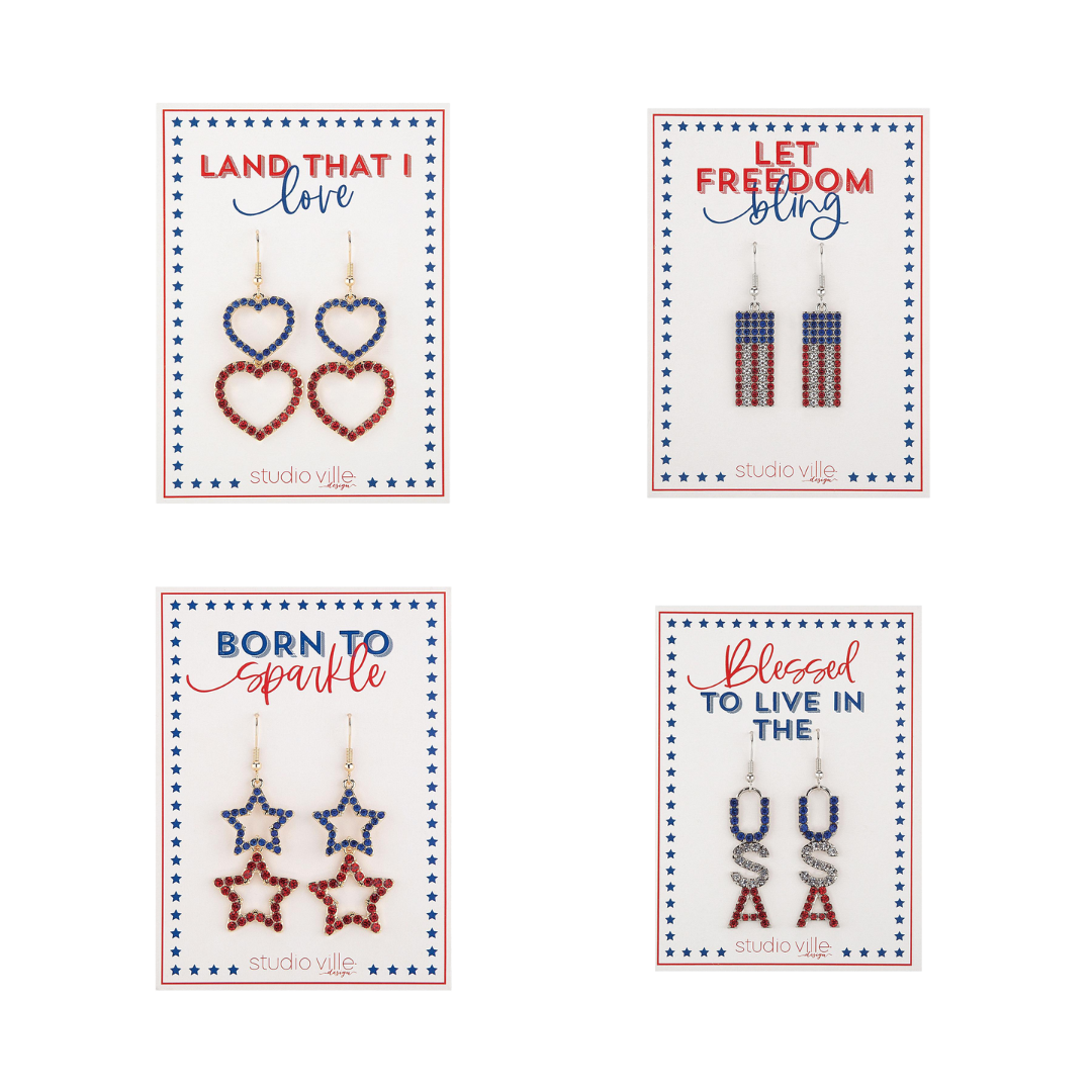 Four pairs of patriotic-themed earrings: heart-shaped, flag-striped, star-shaped, and "USA" lettered.