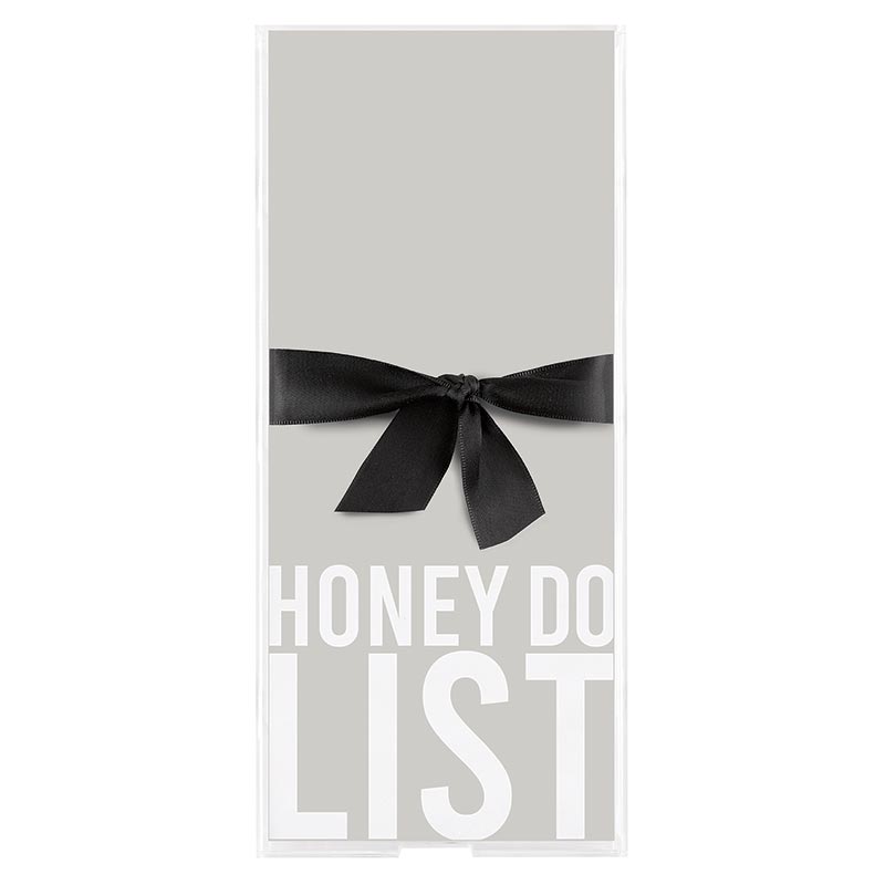 Clear acrylic notepaper tray holding white loose-leaf paper inserts with simple printed messages.
