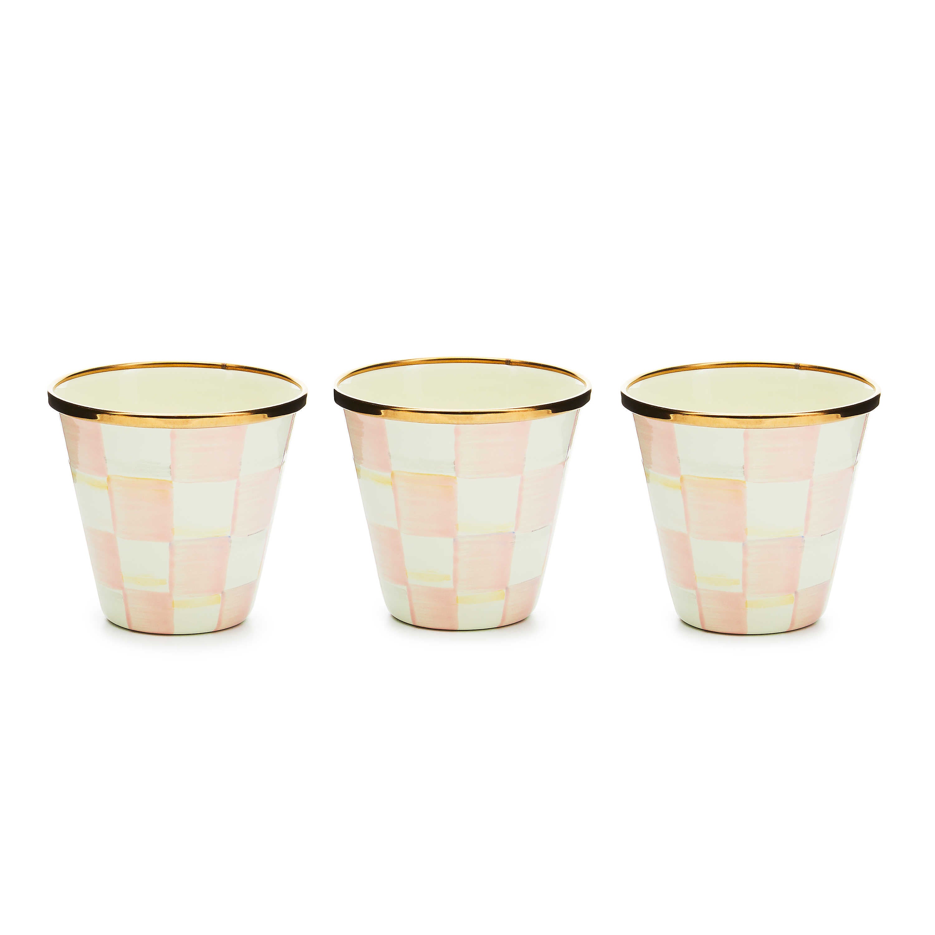 Three hand-painted pink and white checkered herb pots with bronzed stainless steel rims.