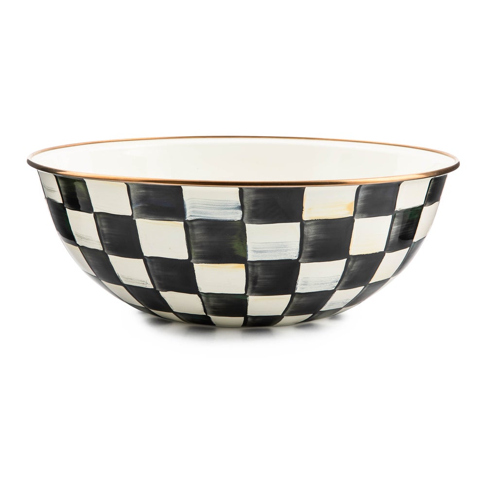 Extra large bowl with hand-painted black and white checks and a bronzed stainless steel rim.