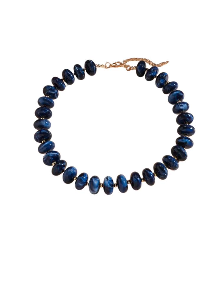 Gradient blue marbled bead necklace with a gold-tone lobster clasp and extender chain.