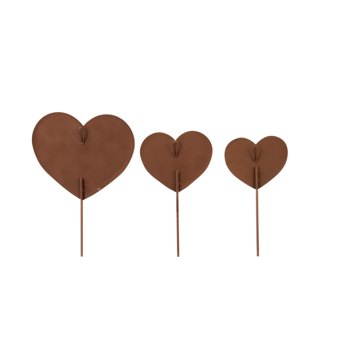 Three brown metal heart-shaped garden stakes of varying sizes.