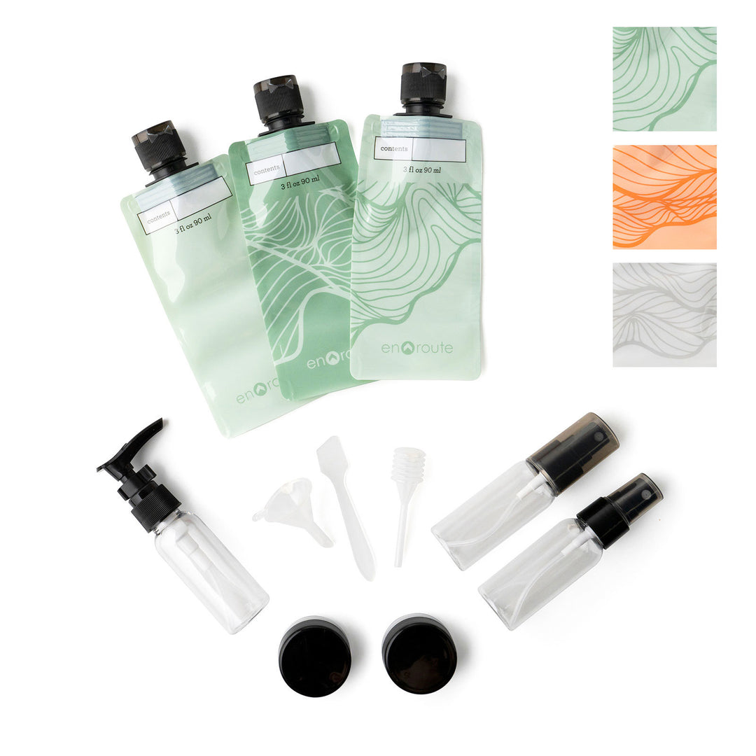 En Route The Jet Set Travel Kit with squeeze pouches, spray and pump bottles, jars, and tools.