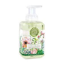 Foaming hand soap dispenser with a white body and pump mechanism.