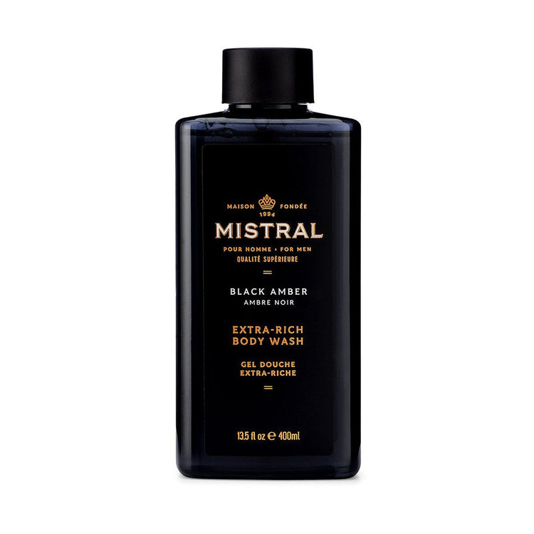 Mistral Black Amber Extra-Rich Body Wash in a 13.5 fl oz black rectangular bottle.
