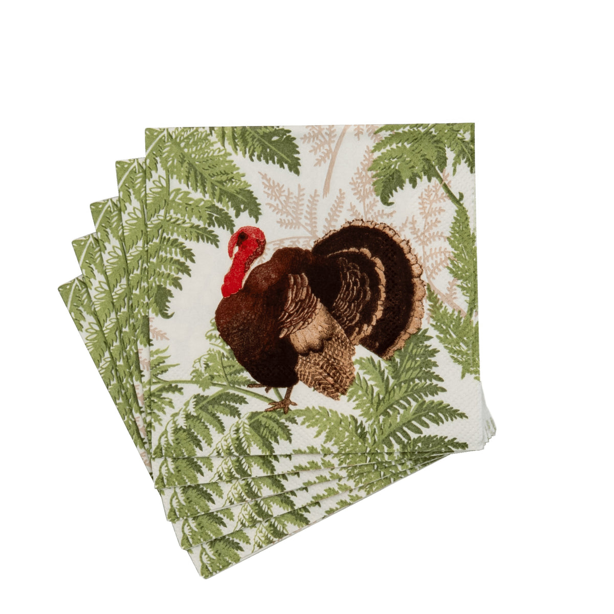 A stack of square cocktail napkins featuring a turkey illustration among green fern leaves.