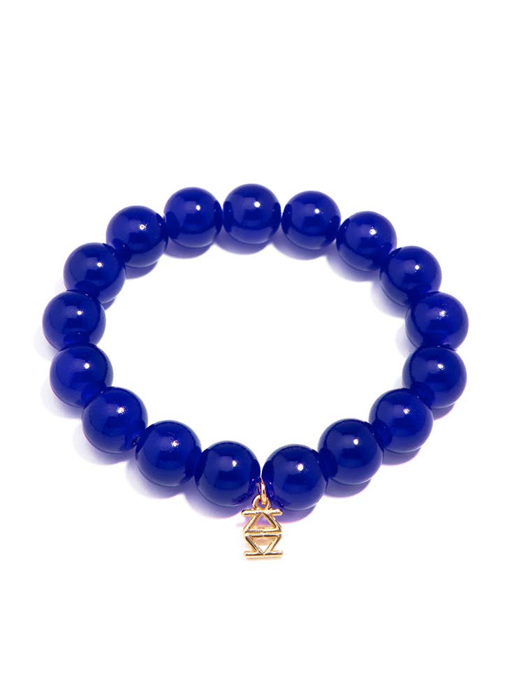 Stretch bracelet with glossy lucite glass beads in a clear finish.