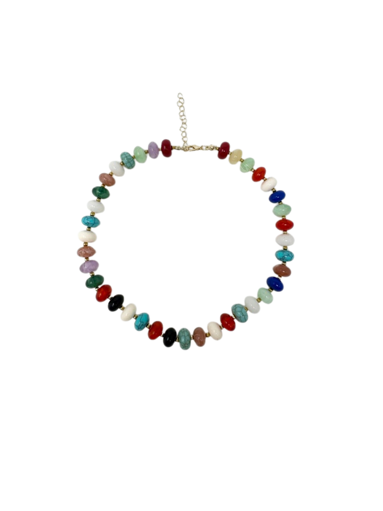 Boho beaded necklace with multi-colored stone beads and a gold-tone lobster clasp and chain.