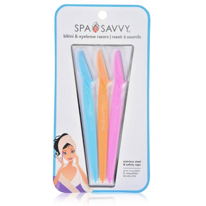 A set containing a bikini razor with an ergonomic handle and eyebrow razors in white plastic packaging.