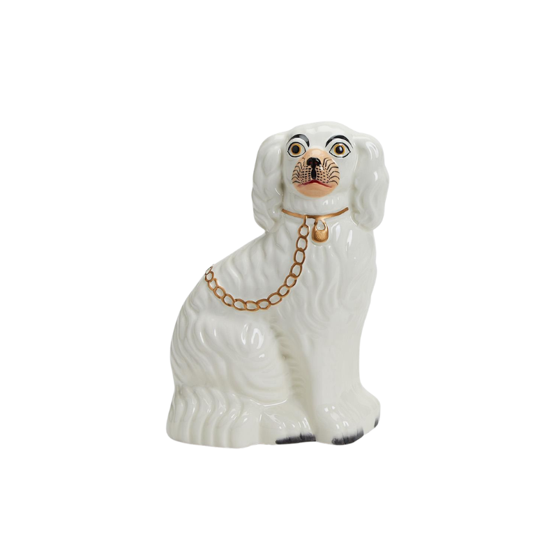White ceramic Staffordshire dog statue with gold collar and chain detail.