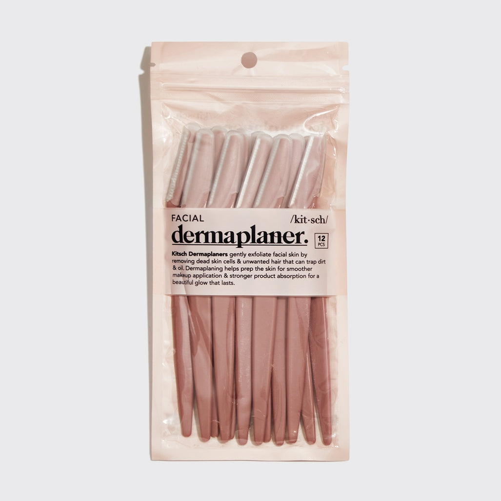 Blush-colored eco-friendly dermaplaner tool with ergonomic handle