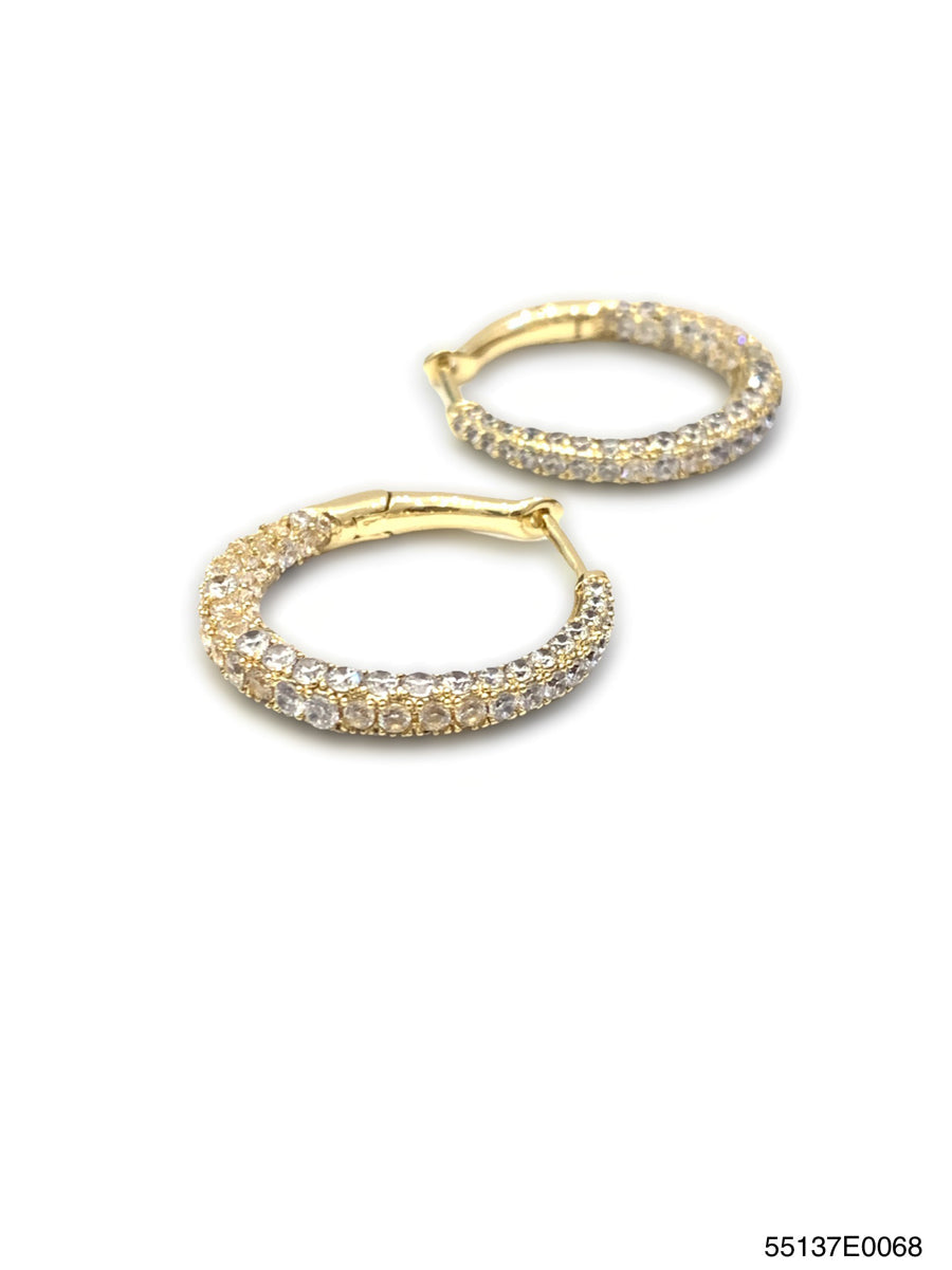 Lara Inside Out hoop earrings featuring a two-tone gold finish with an open circular silhouette and contrasting inner band.