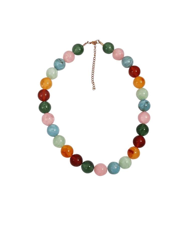 Chunky statement necklace with large, colorful marbled beads and an adjustable gold chain.