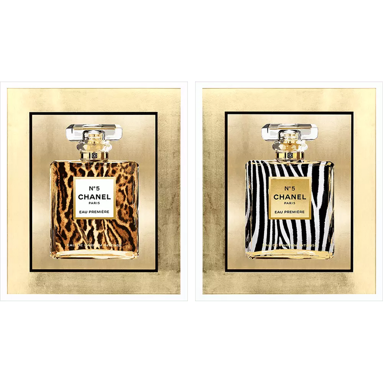 Two framed gold wall art pieces featuring Chanel No. 5 perfume bottles in leopard and zebra prints.