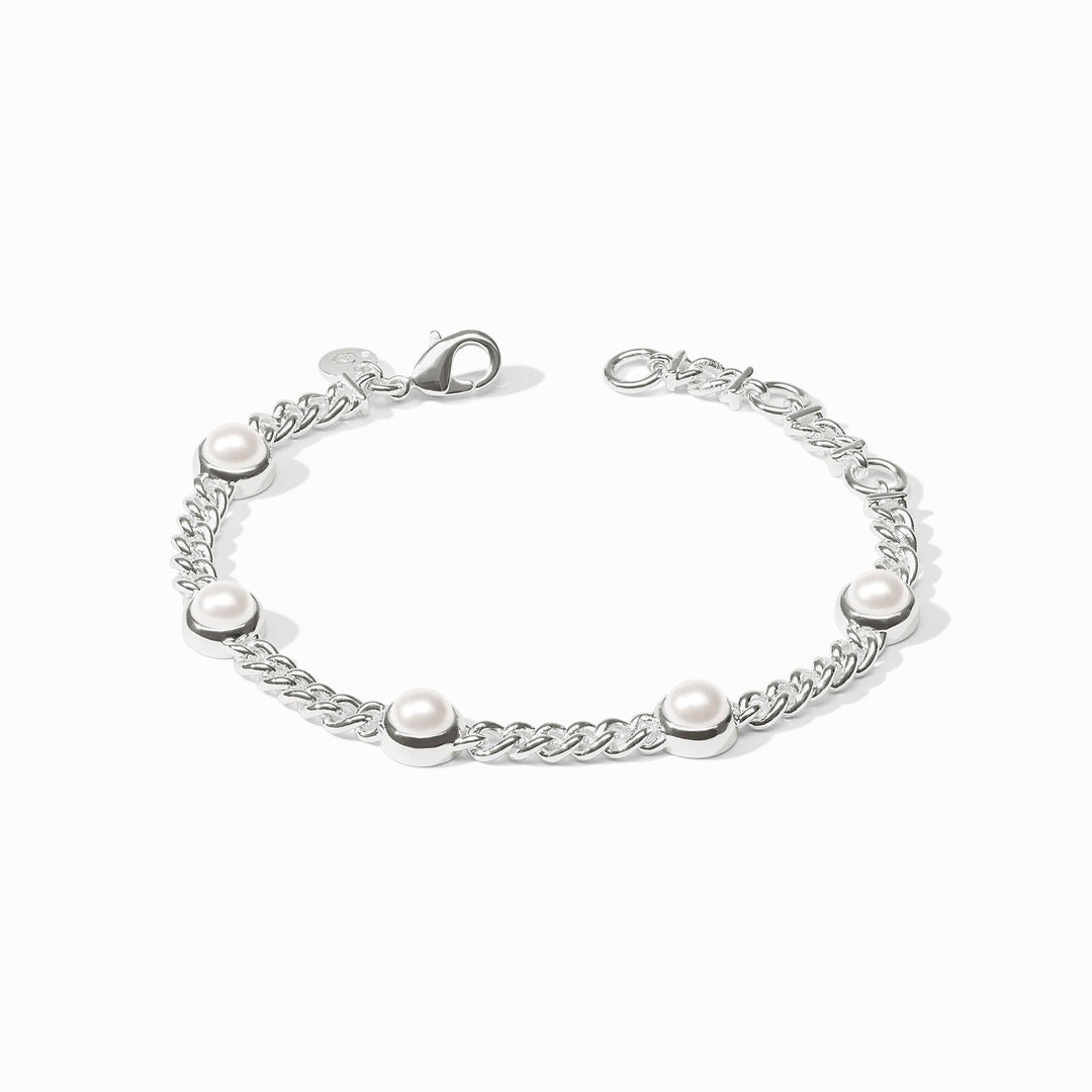 Silver chain bracelet featuring five evenly spaced white pearls and a lobster clasp.