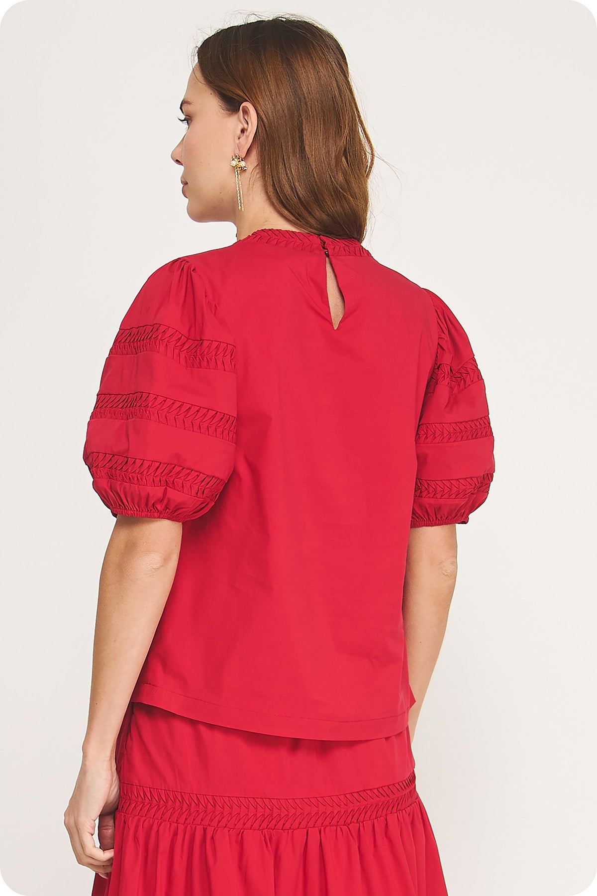 Venice Reverse Pintuck Puff Sleeve Top in light fabric with gathered sleeves and a relaxed silhouette.