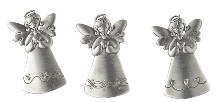 Three silver angel pocket tokens with different dress patterns, each holding a heart.