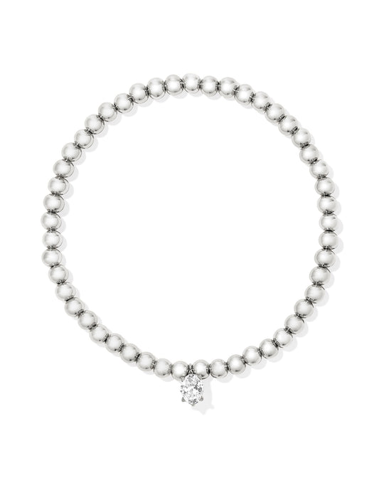 Silver-tone beaded stretch bracelet featuring a small oval-cut white cubic zirconia charm.