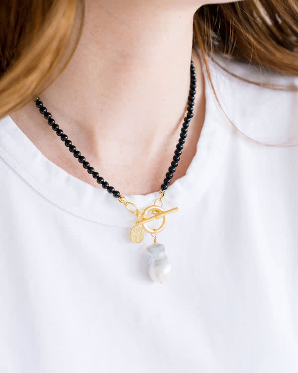 Katie necklace featuring mini genuine stone beads in colorful pops anchored by a front-facing toggle clasp and finished with a baroque pearl detail.