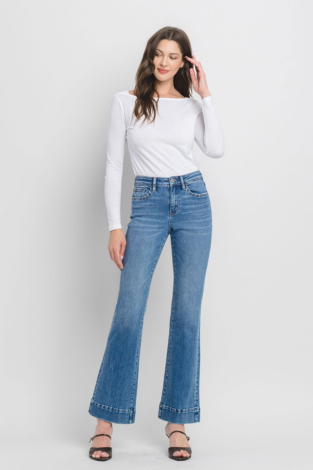 Kayla high-rise relaxed flare jeans in dark wash denim with a trouser hem.