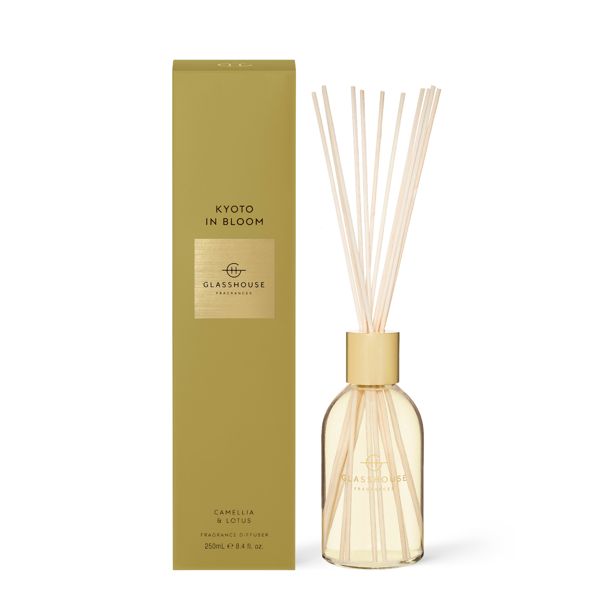 Kyoto In Bloom diffuser with amber liquid in a frosted glass bottle featuring reeds.
