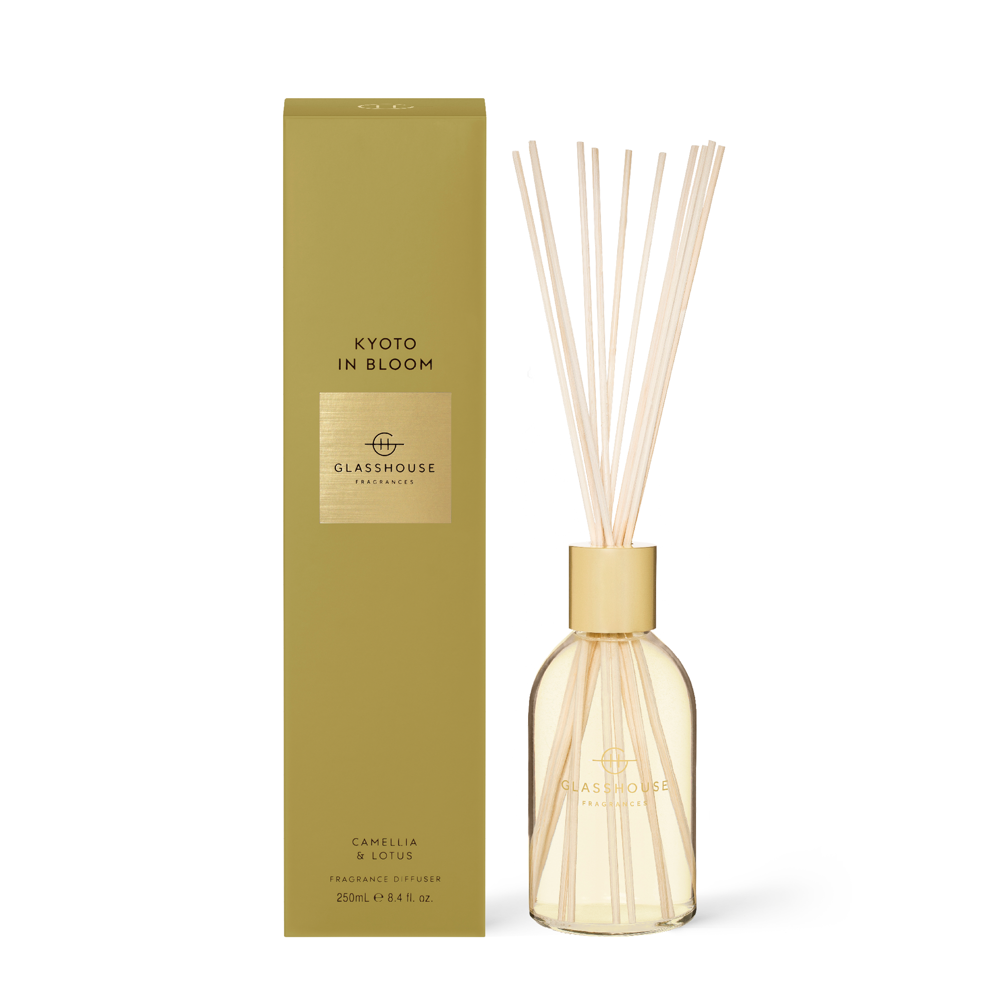 Kyoto In Bloom diffuser with amber liquid in a frosted glass bottle featuring reeds.