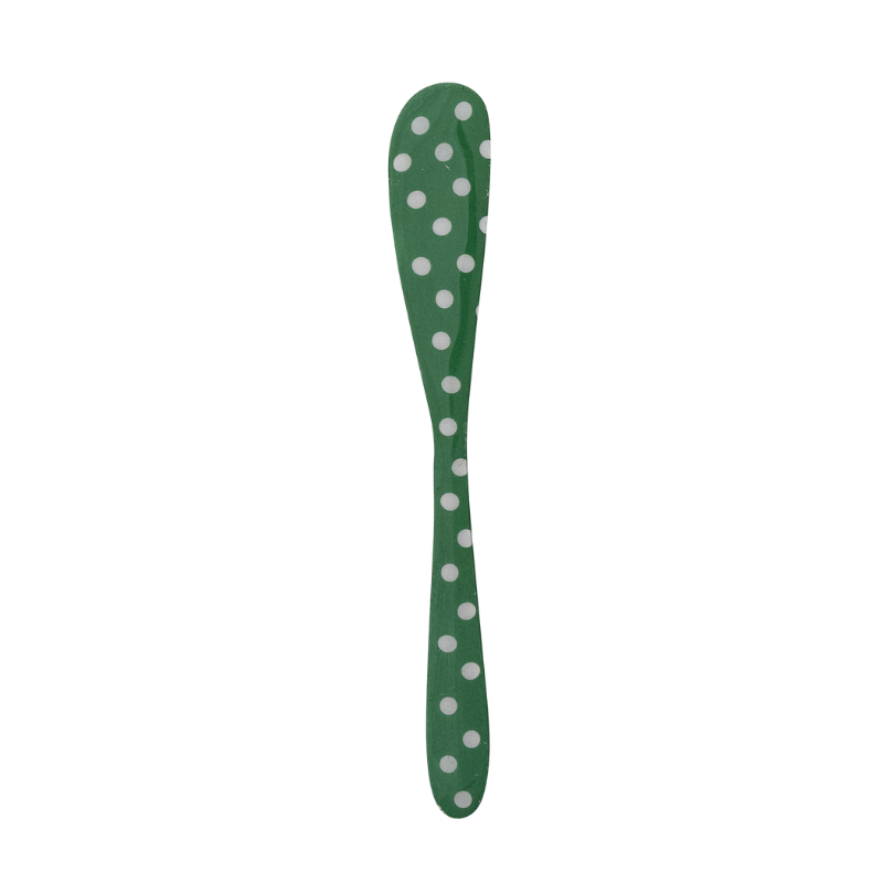 Green enameled stainless steel canape knife with white polka dots.