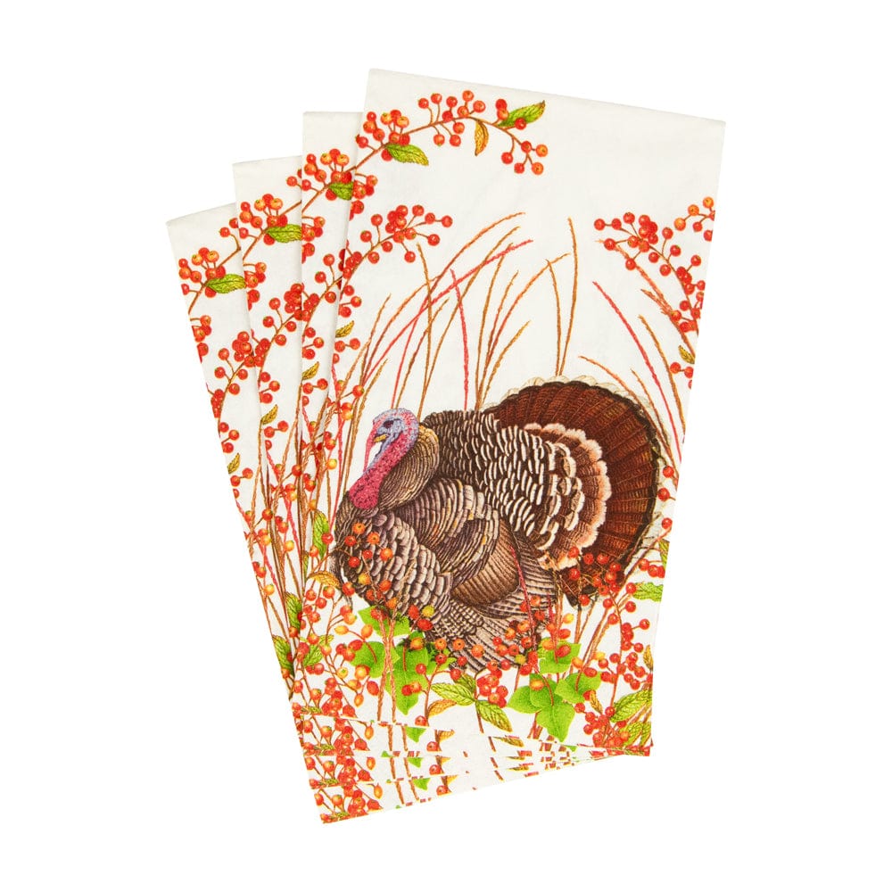 Three folded Turkey and Berries guest towel napkins featuring a turkey and red berry branches.