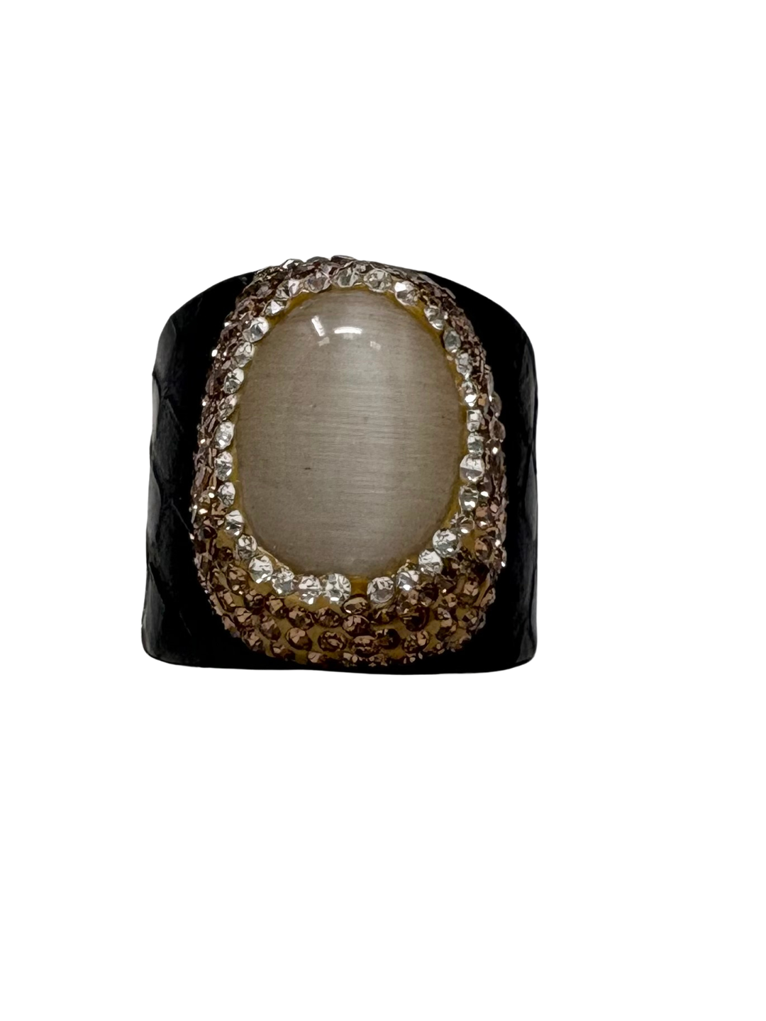 Queen of Sheba fashion ring with a large oval cat's eye stone and crystal-encrusted border.