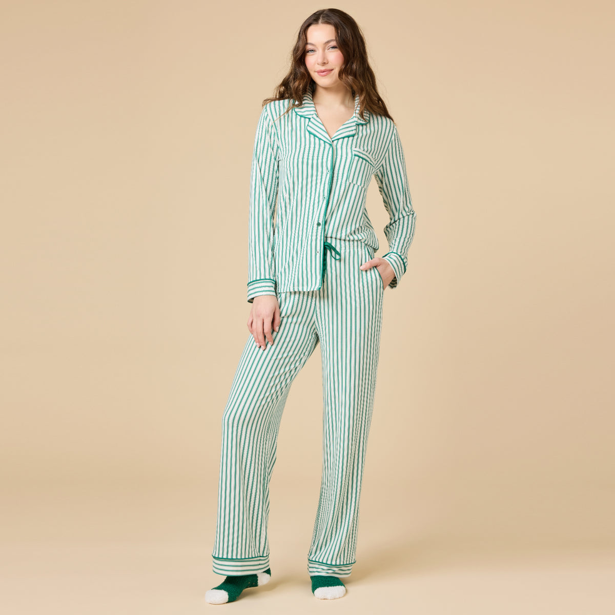 Woman wearing the Aria Slim Notch Collar PJ Set in a green and white vertical stripe pattern.