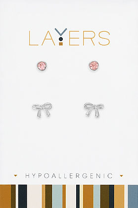 Silver duo stud earring set featuring pink cubic zirconia rounds and silver bow designs.