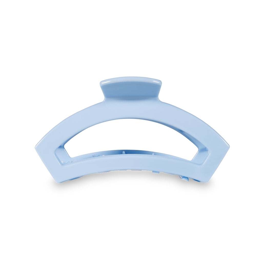 Medium open-style hair clip with bendable teeth in a neutral tone.