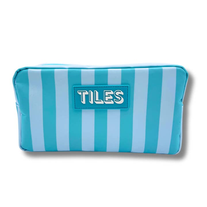 Blue and light blue striped mahjong tile bag with a rubber patch that says TILES.