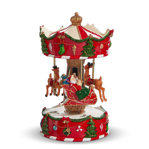 Multicolor resin wind-up carousel featuring Santa's sleigh with reindeer playing 'Santa Claus is Coming to Town'.