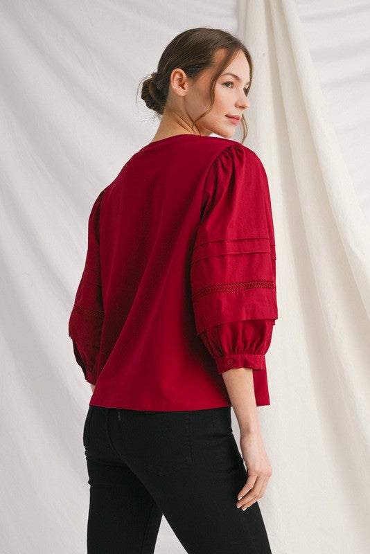 Alice solid top with ladder lace trim at neckline and cuffs