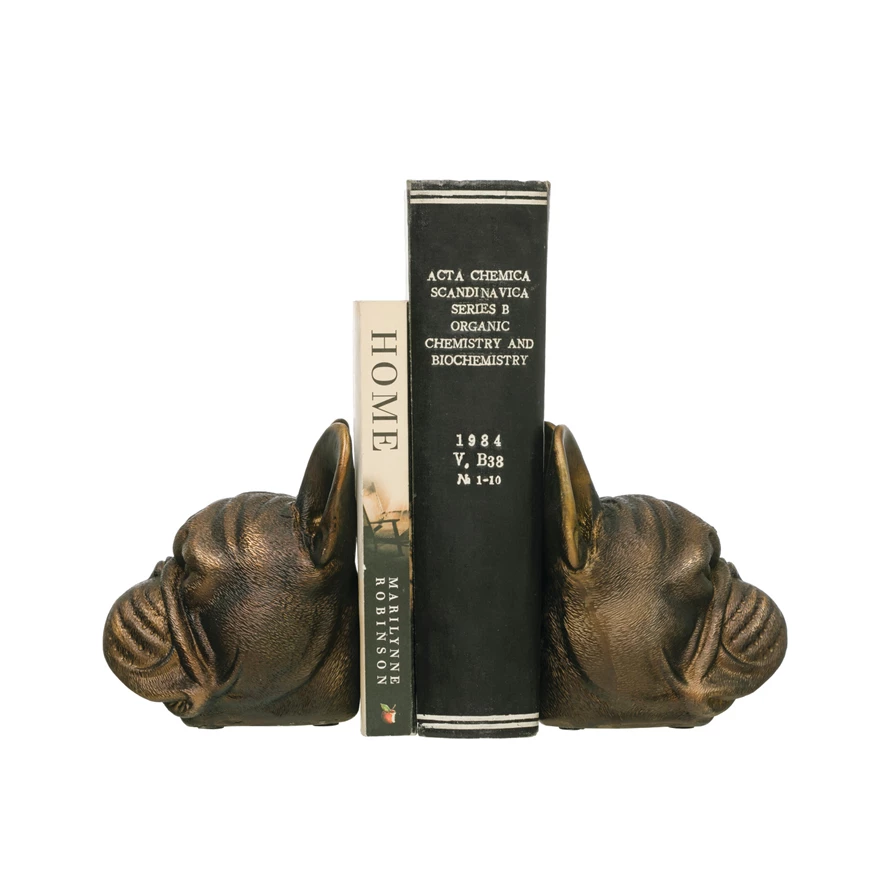Bronze-finish resin bookends shaped like stylized dog heads.