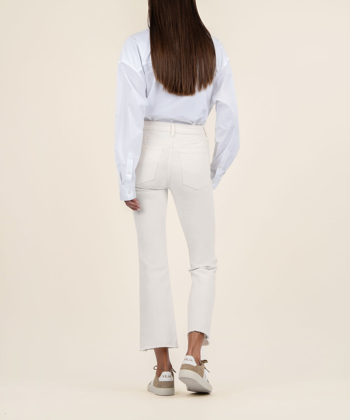 Ecru raw hem high waist ankle flare jeans in smooth stretch denim with a tonal wash.