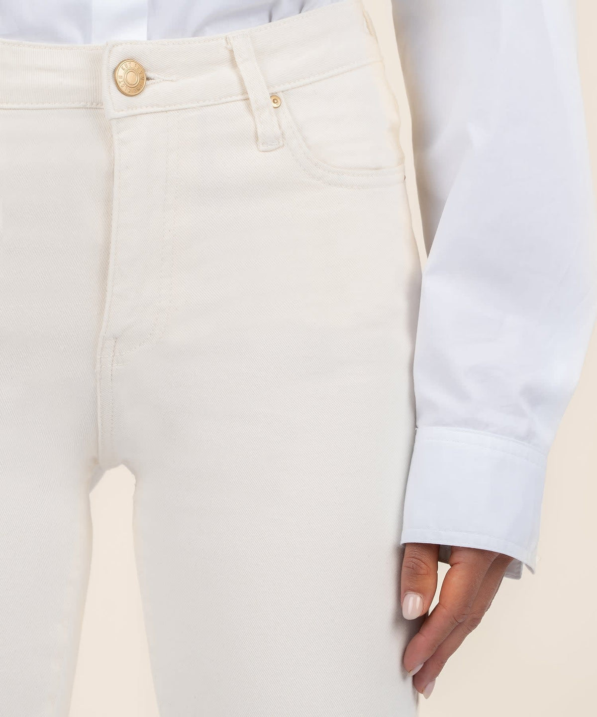 Ecru raw hem high waist ankle flare jeans in smooth stretch denim with a tonal wash.